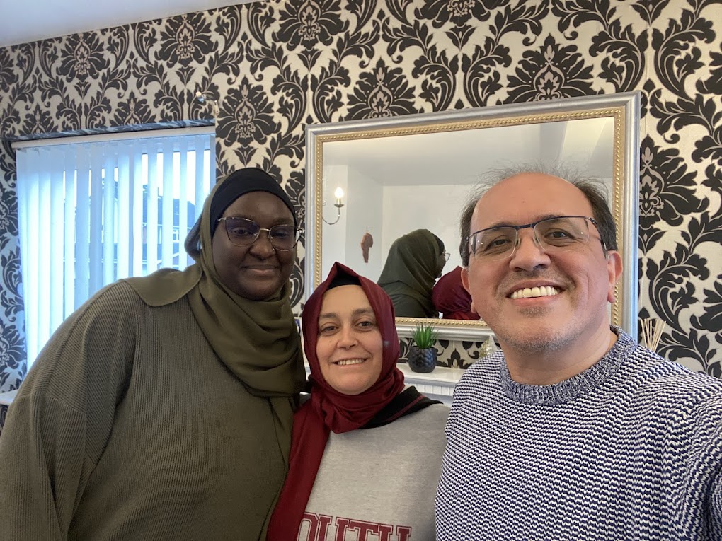 Three members of the Knighton community together indoors